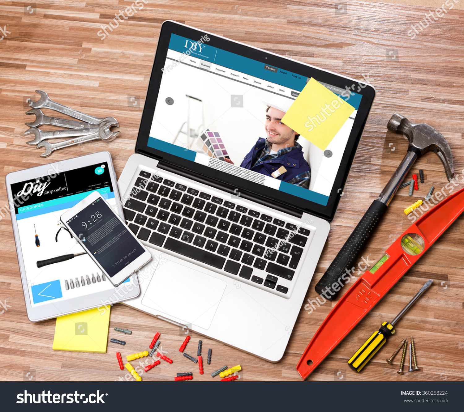 View of a Wood handyman's desk in high definition with laptop, tablet and mobile #360258224
