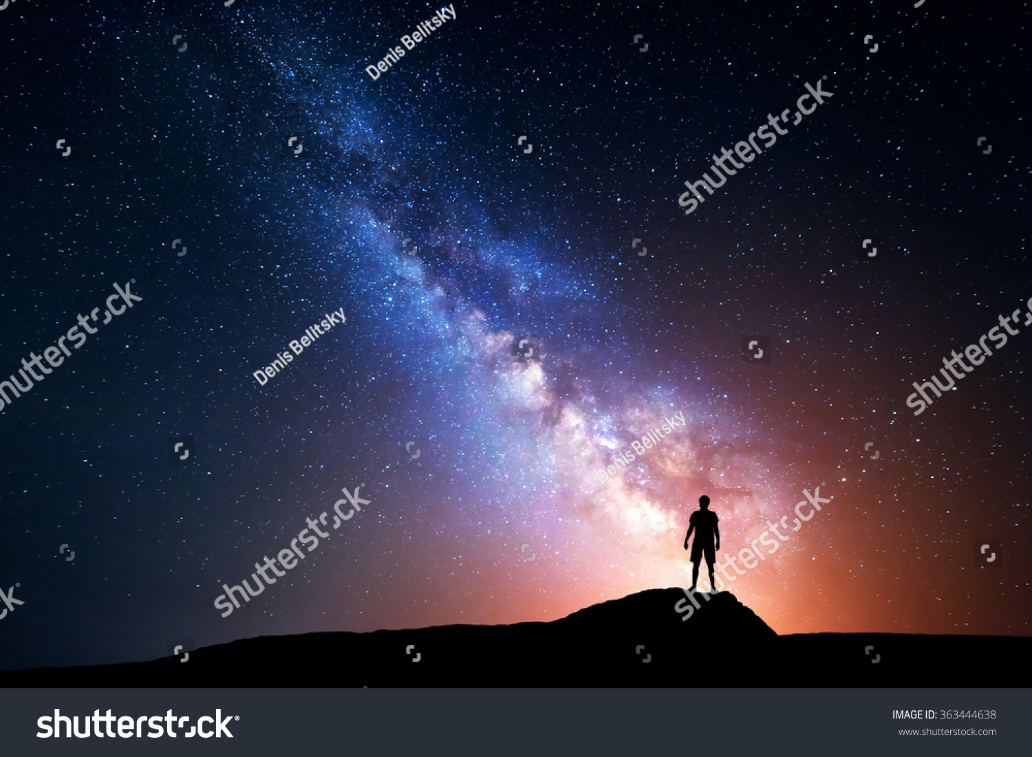 Milky Way. Night sky with stars and silhouette of a standing happy man with yellow light. Space background #363444638