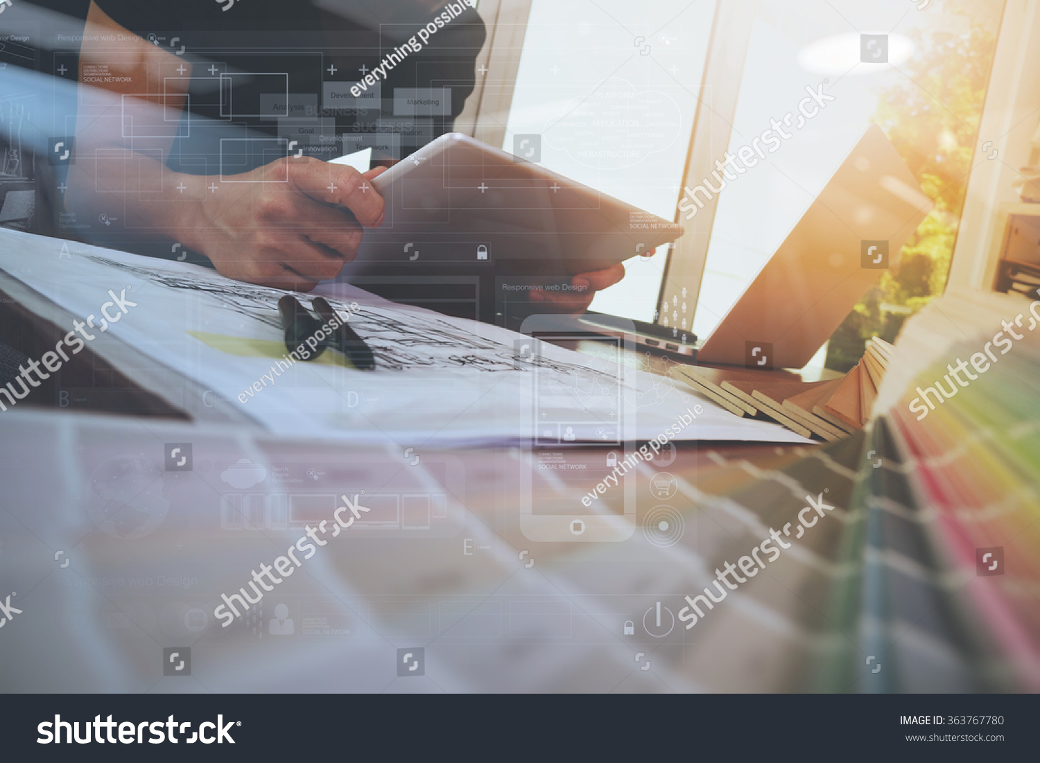 Designer hand working with laptop computer and smart phone and digital tablet with digital design diagram layer on wooden desk as responsive web design ,Social distancing and Working from home concept #363767780