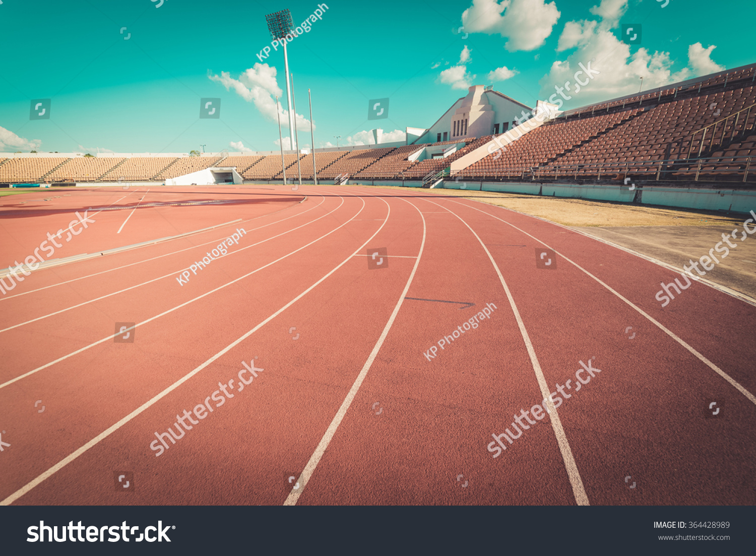 Red running track in stadium.  #364428989