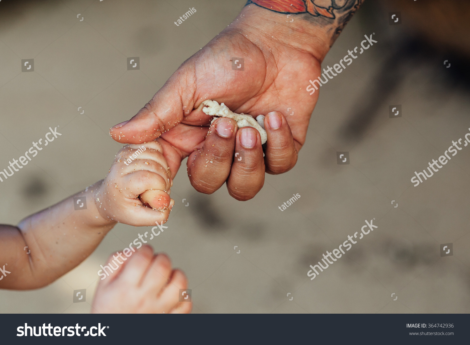 father's hand lead his child  on the beach  outdoor, trust family concept.father's and son's hands #364742936