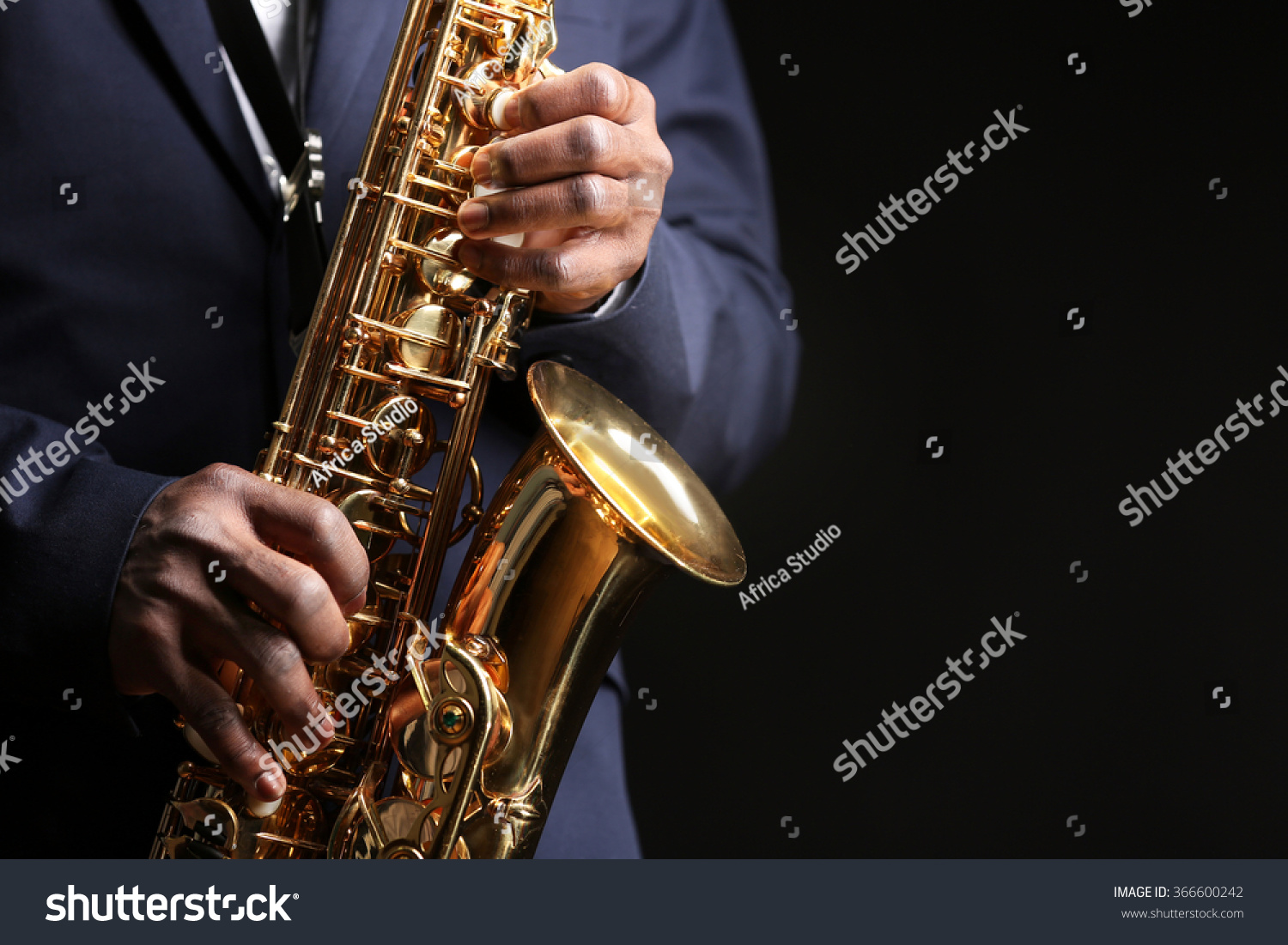 African American jazz musician playing the saxophone, closeup #366600242