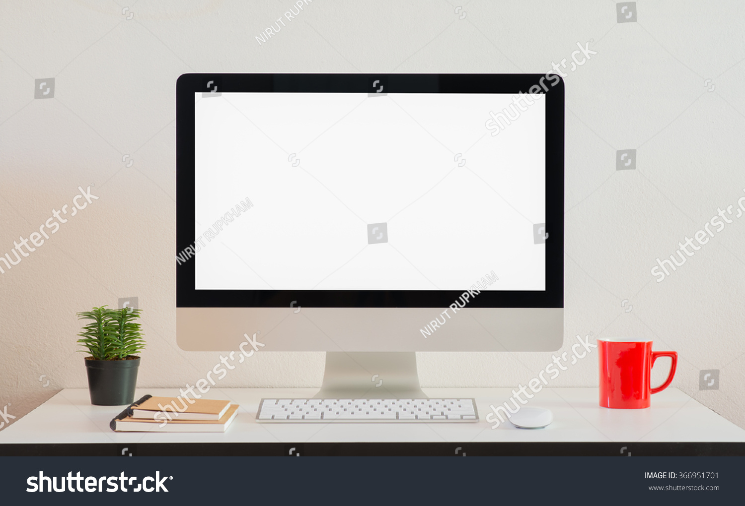 Computer screens isolated stand on a table with red cup and note book. #366951701