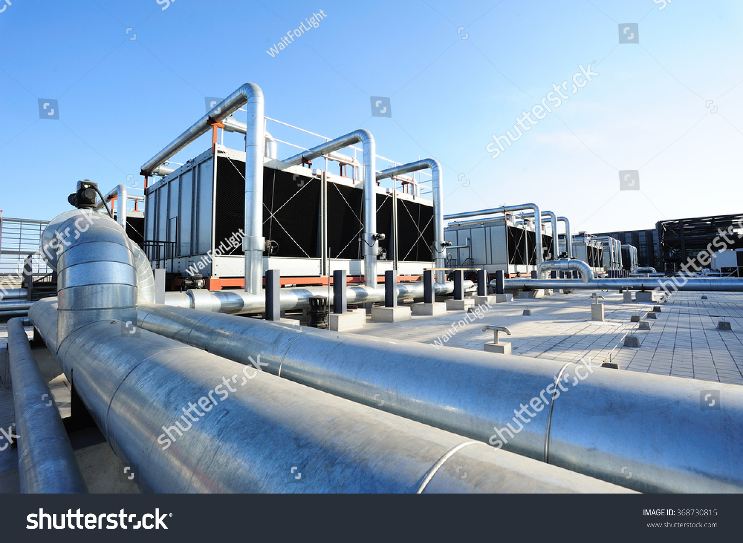 Sets of cooling towers in data center building. #368730815