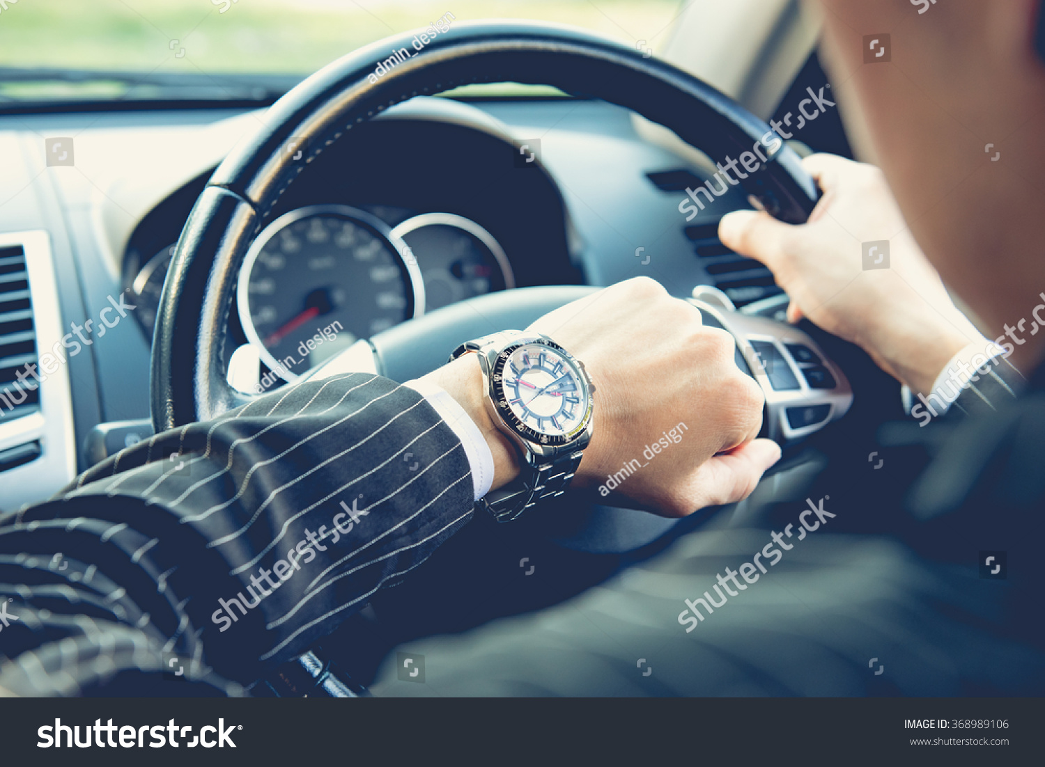 Man driving a car and looking at watch ,business concept ,vintage tone #368989106