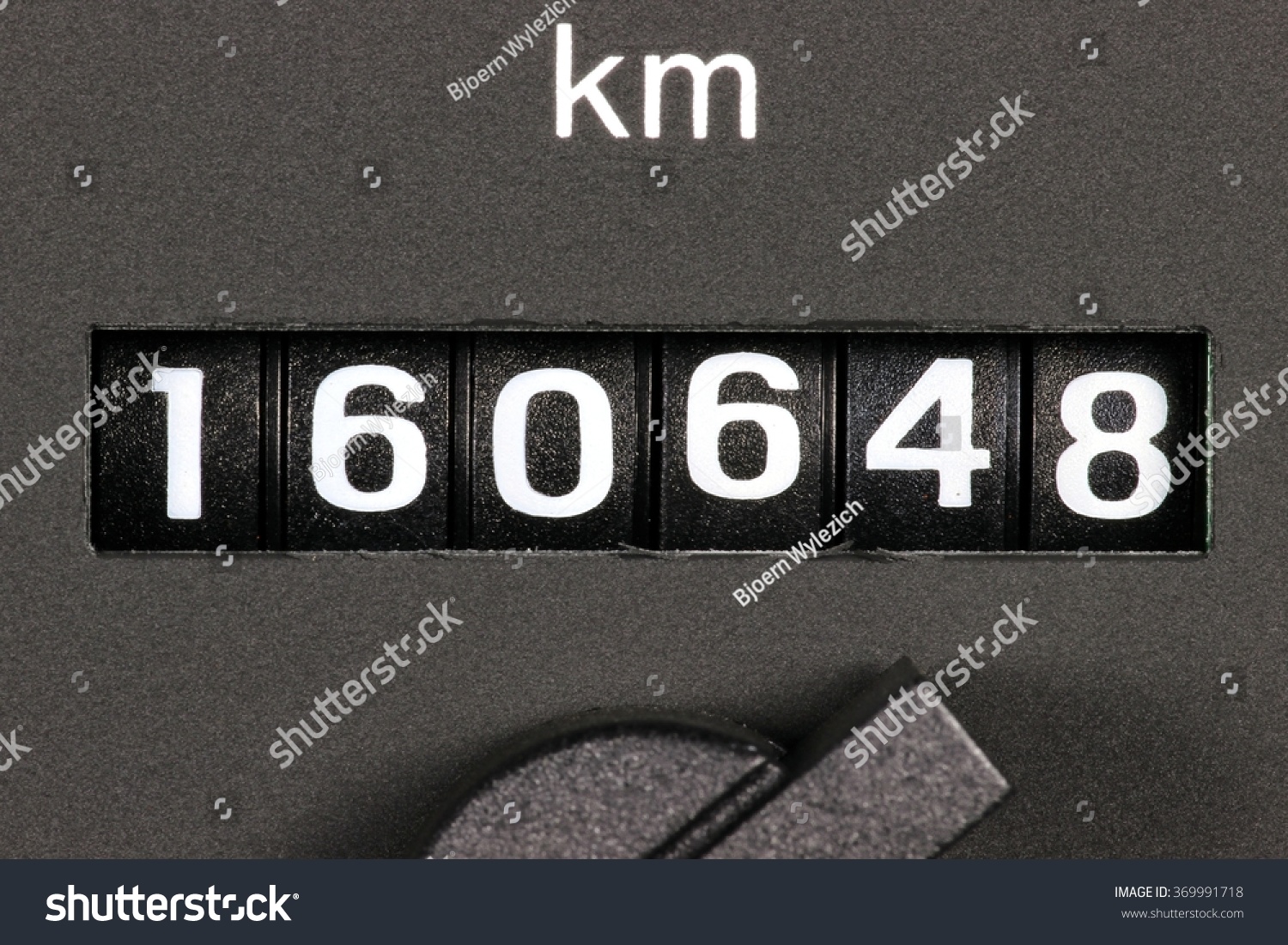 odometer of used car showing mileage of 160648 km #369991718