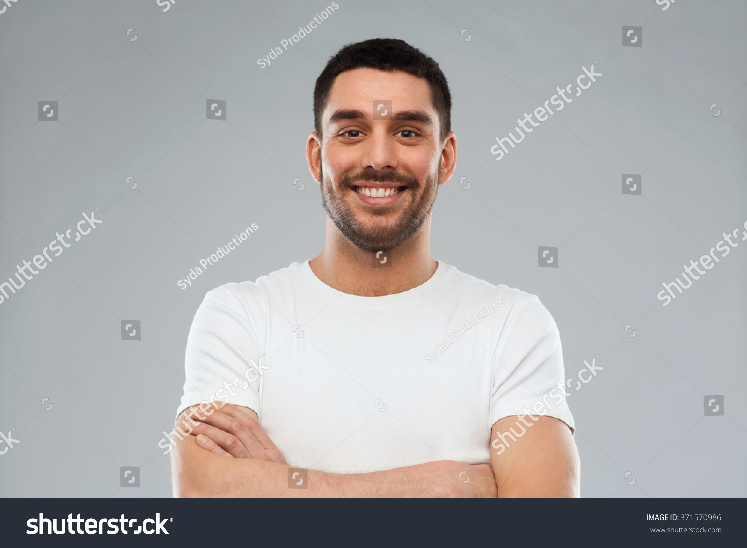smiling man with crossed arms over gray background #371570986