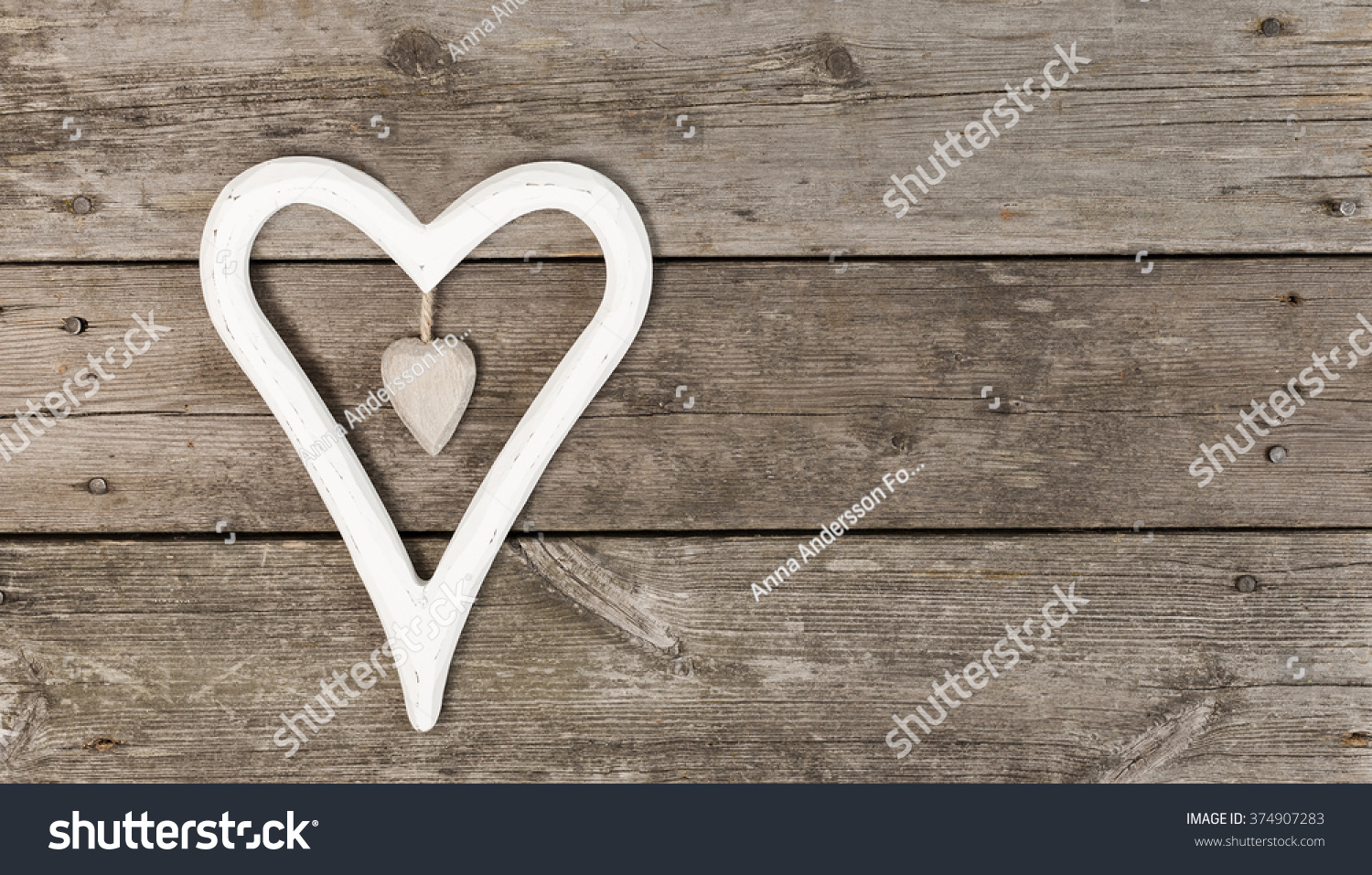 Decoration heartshaped on wooden background with copy space #374907283