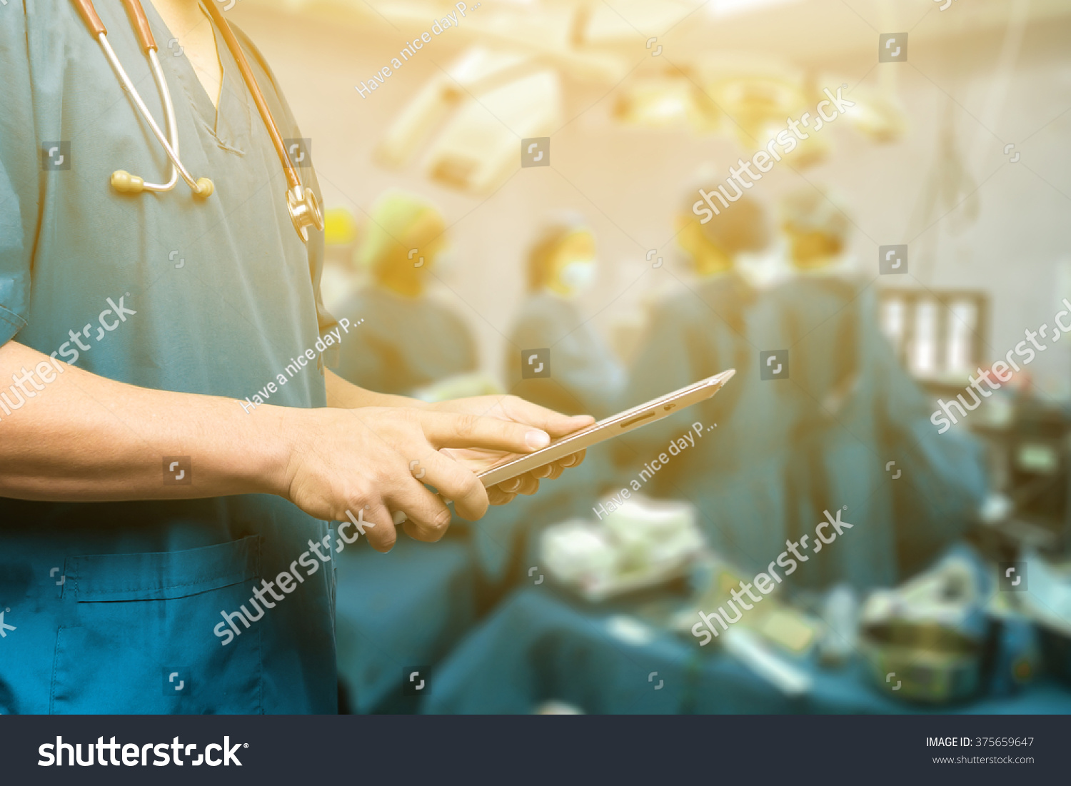 Male doctor,medical students or surgeon using  tablet and laptop during the conference,Health Check with digital system support for patient,test results and information  registration,selective focus #375659647