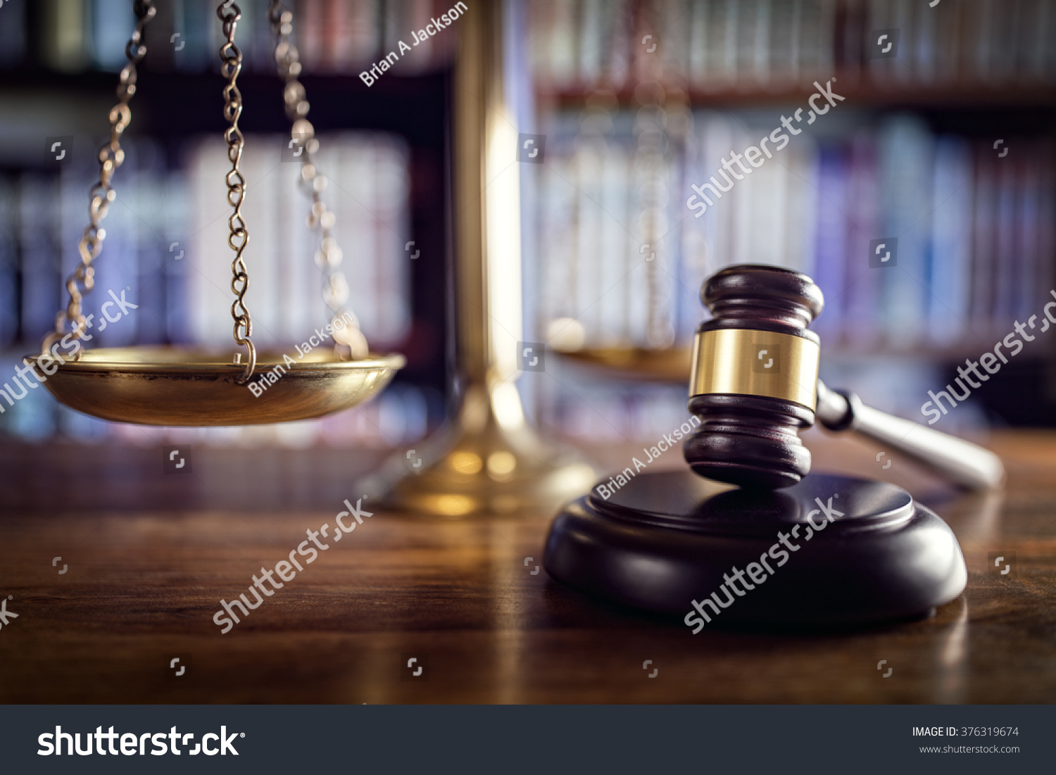 Judge gavel, scales of justice and law books in court #376319674