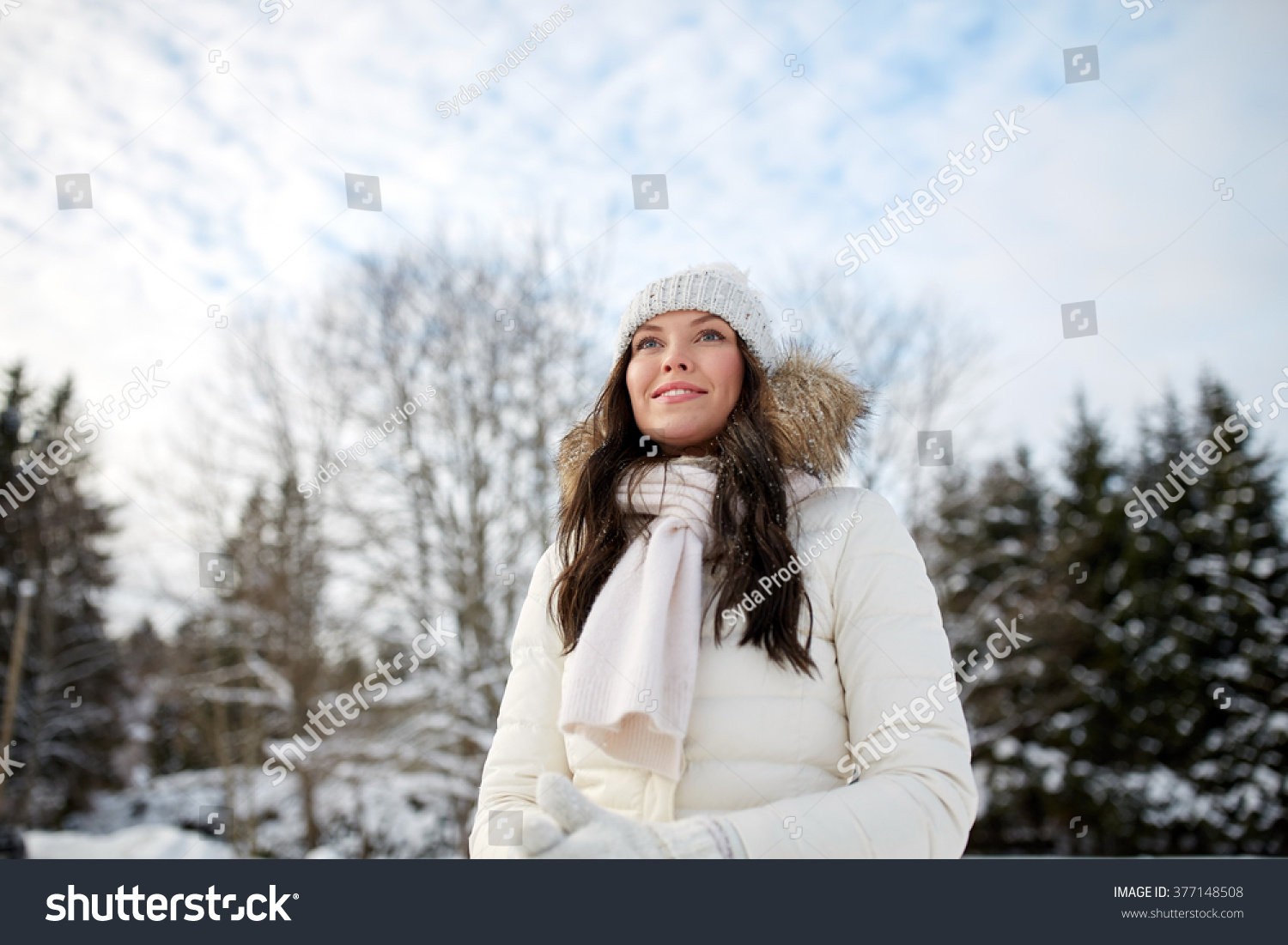 people, season and leisure concept - happy woman outdoors in winter #377148508