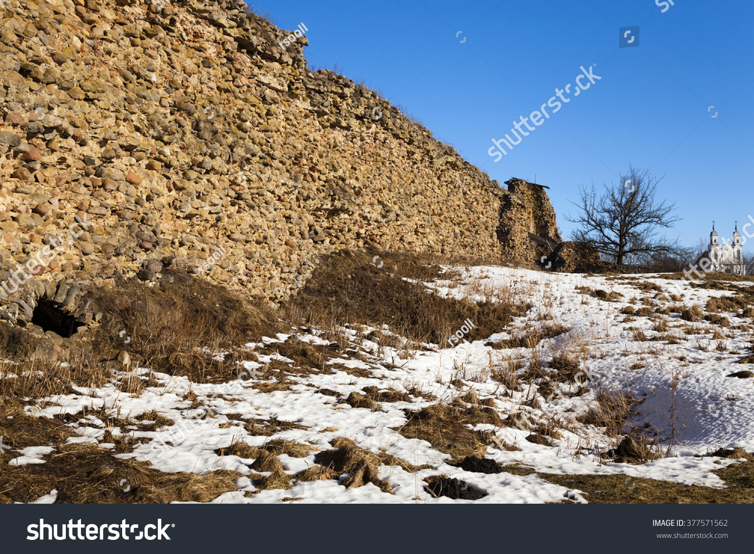   the ruins of the ancient ramparts of the castle, located in the village of Krevo. Belarus. Winter #377571562