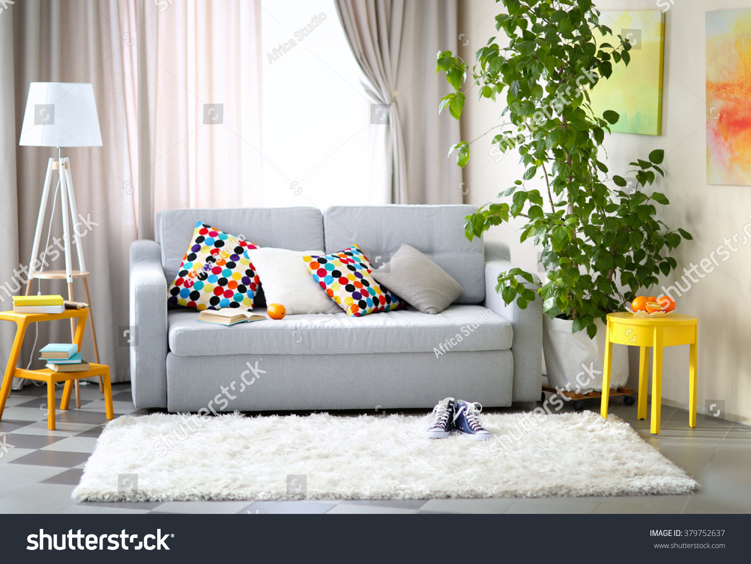 Living room interior with sofa, lamp and green tree #379752637