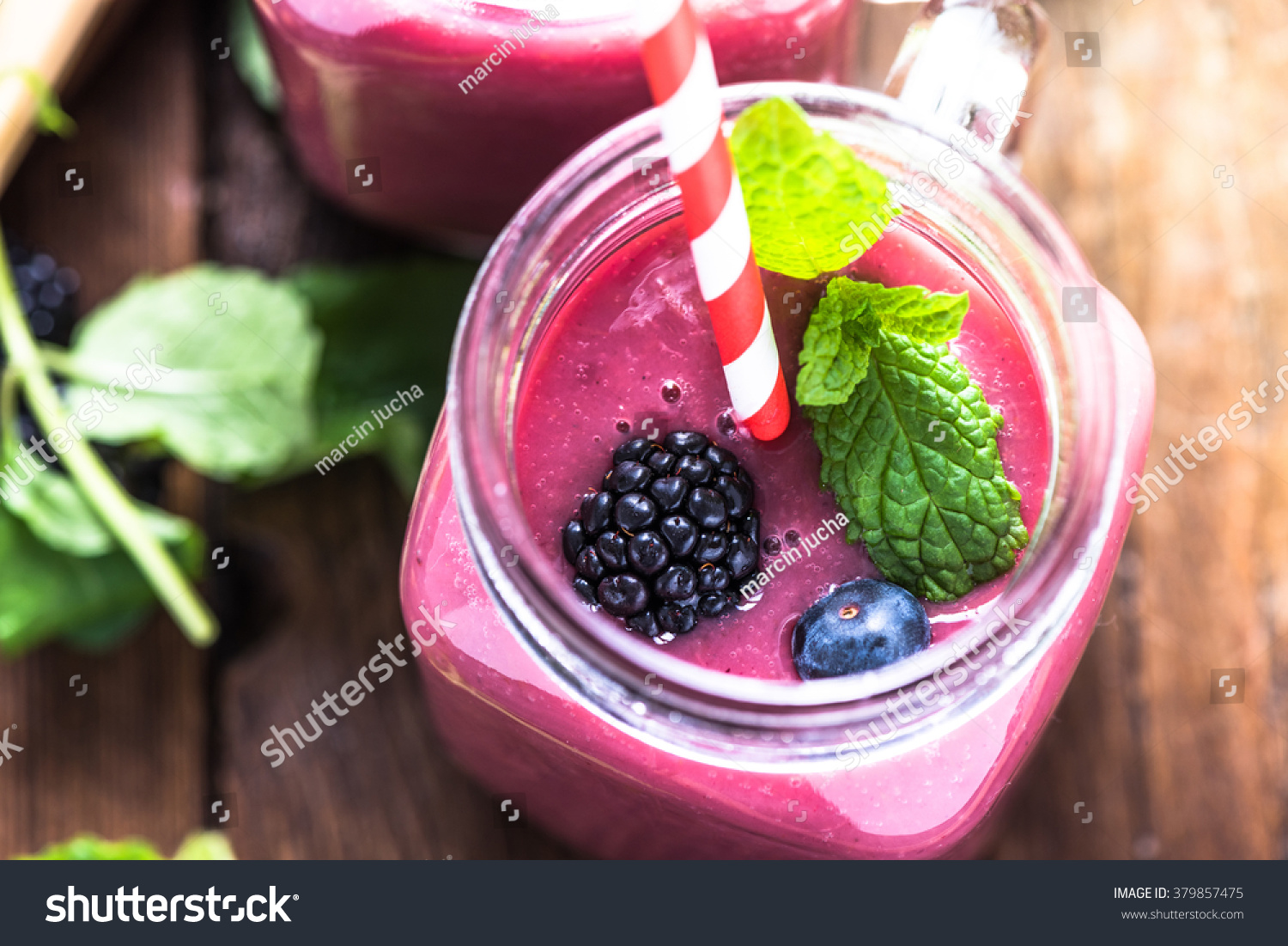Well being and weight loss concept, berry smoothie.On wooden table with ingredients, from above. #379857475