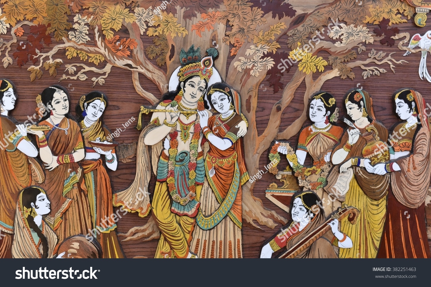 Raised crafted Indian Hindu Gods Krishna and Radha on wood, whole background #382251463