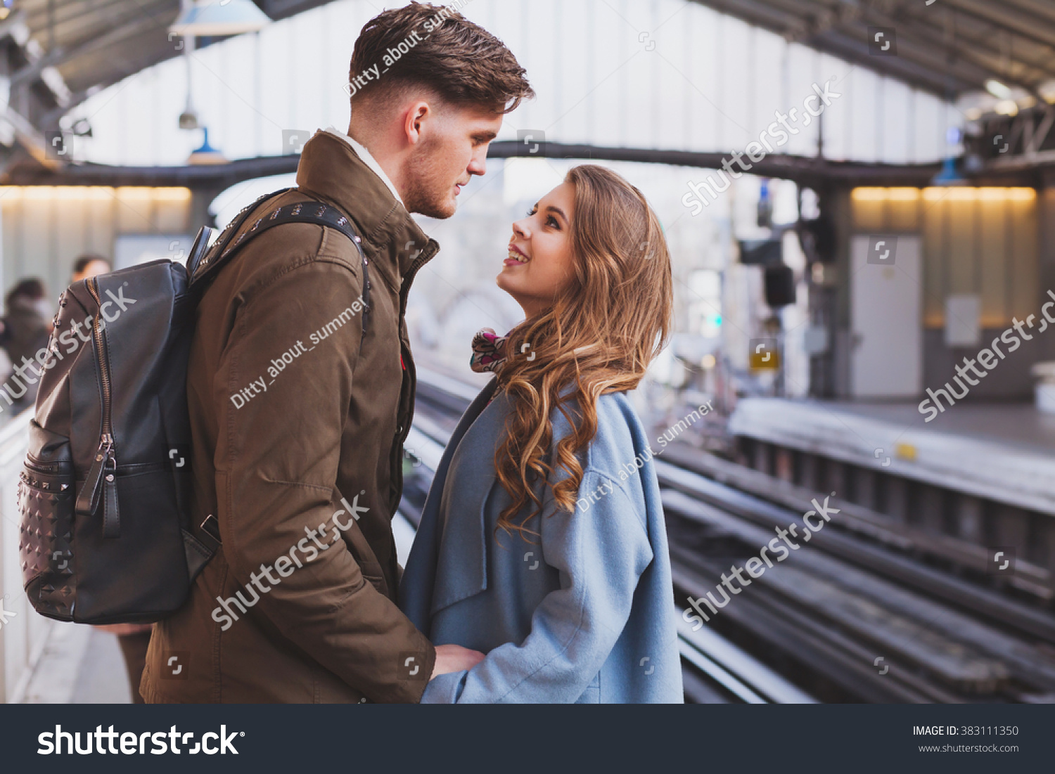 long distance relationship, couple on platform at the train station, meeting or parting concept #383111350