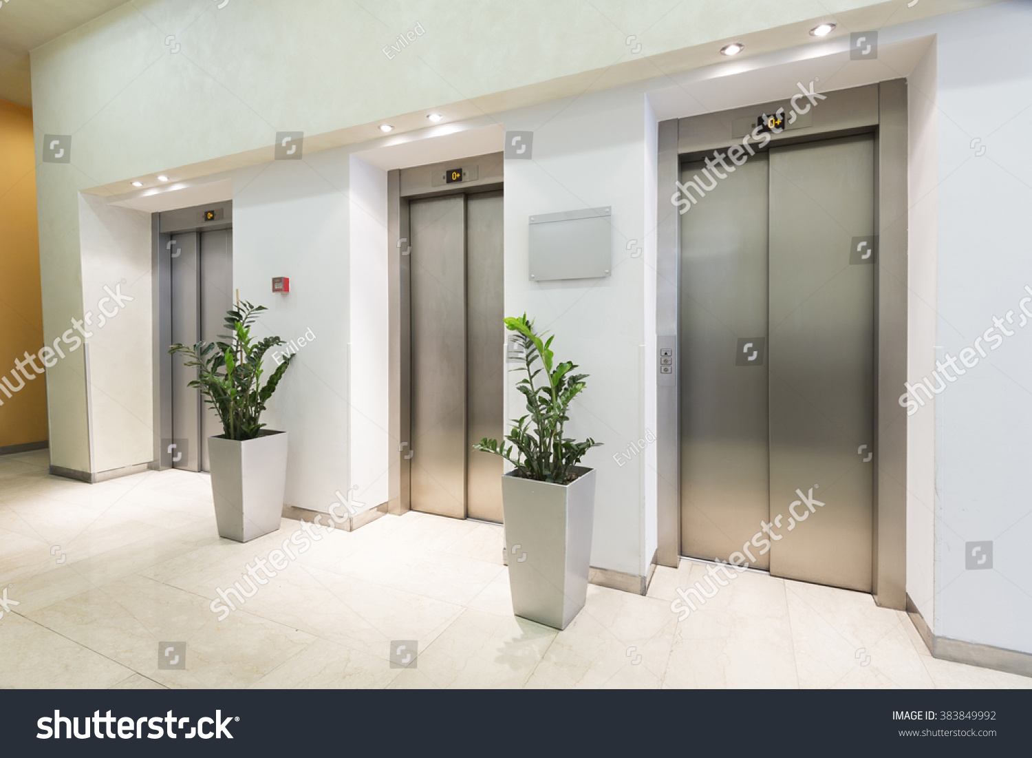 Three elevators in hotel lobby #383849992