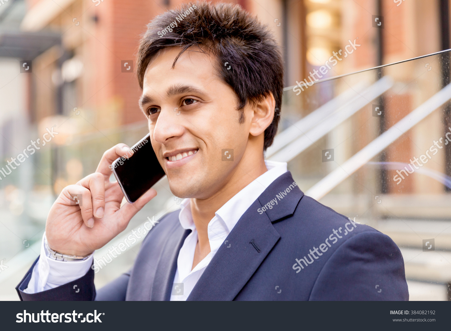 Portrait of confident businessman outdoors #384082192