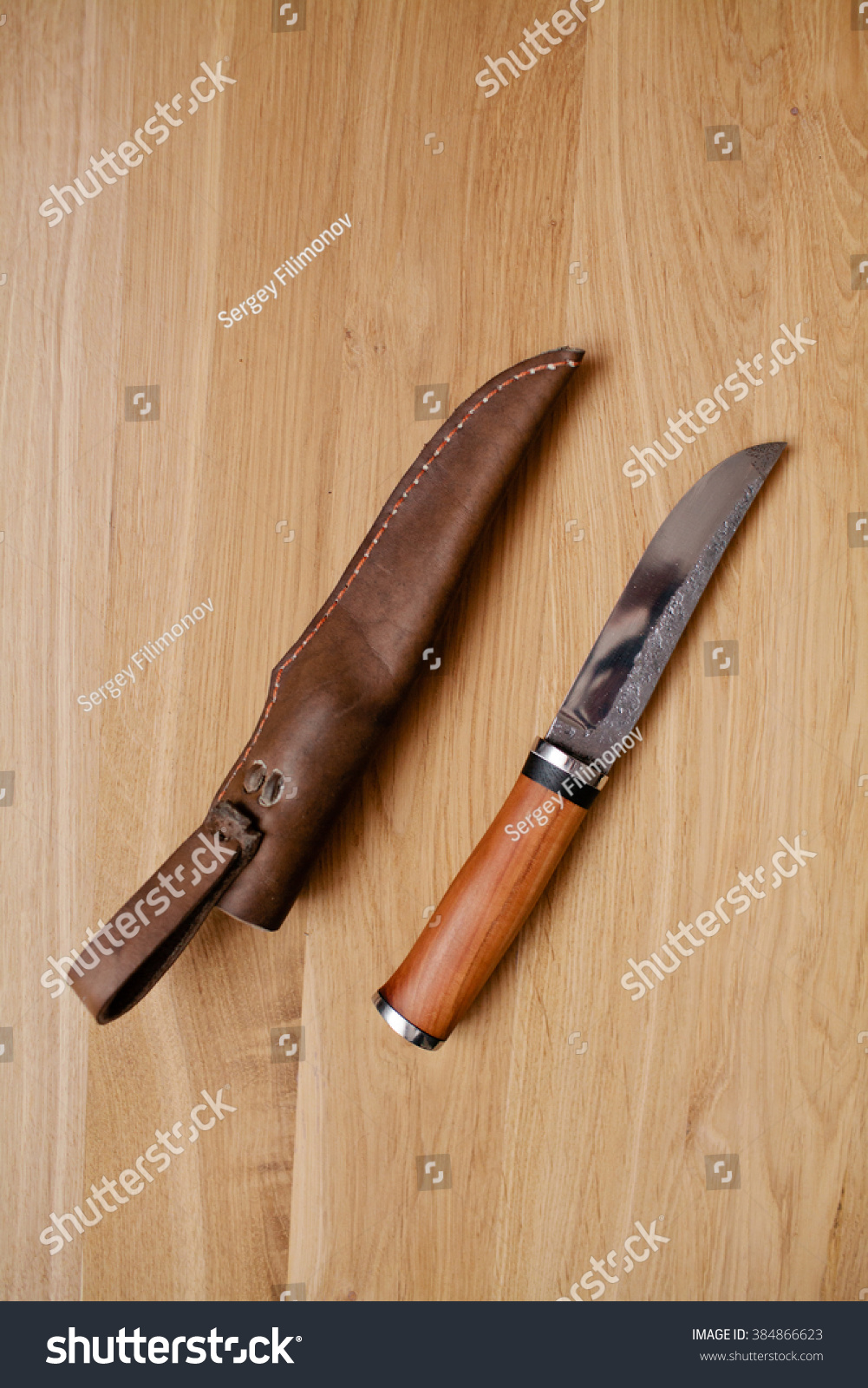 Knife with the wooden handle and a leather sheath #384866623