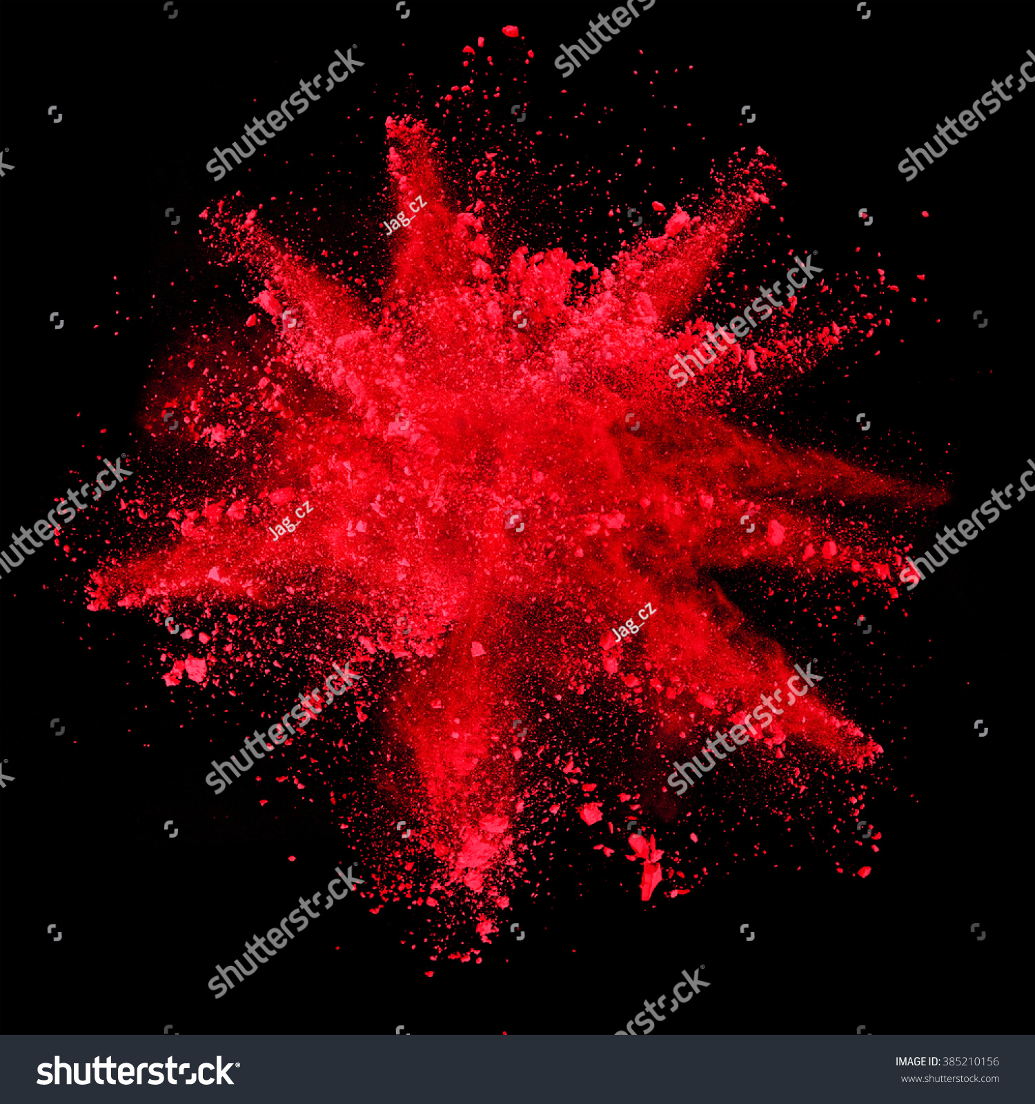 Explosion of red powder on black background #385210156