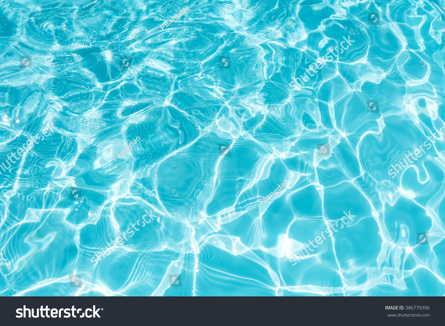 Ripple Water in swimming pool with sun reflection #386779396