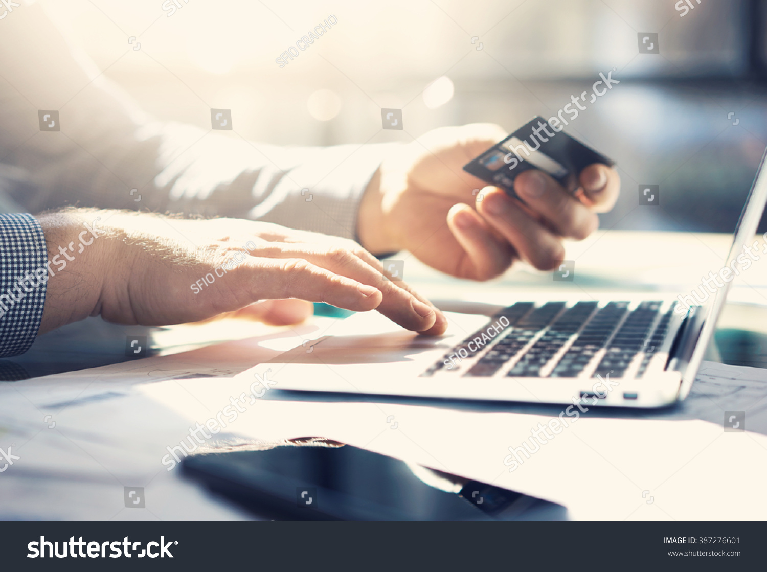 Photo businessman working with generic design notebook. Online payments, banking, hands keyboard. Blurred background, film effect. horizontal mockup #387276601