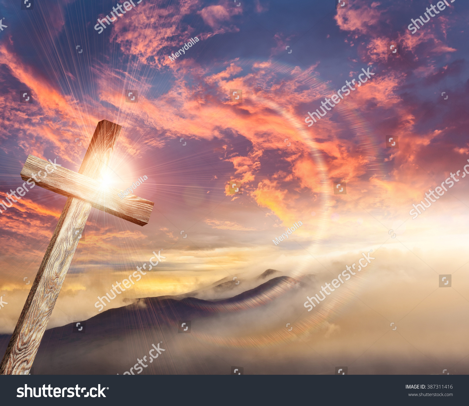 Old brown wooden cross, with sun flash  #387311416