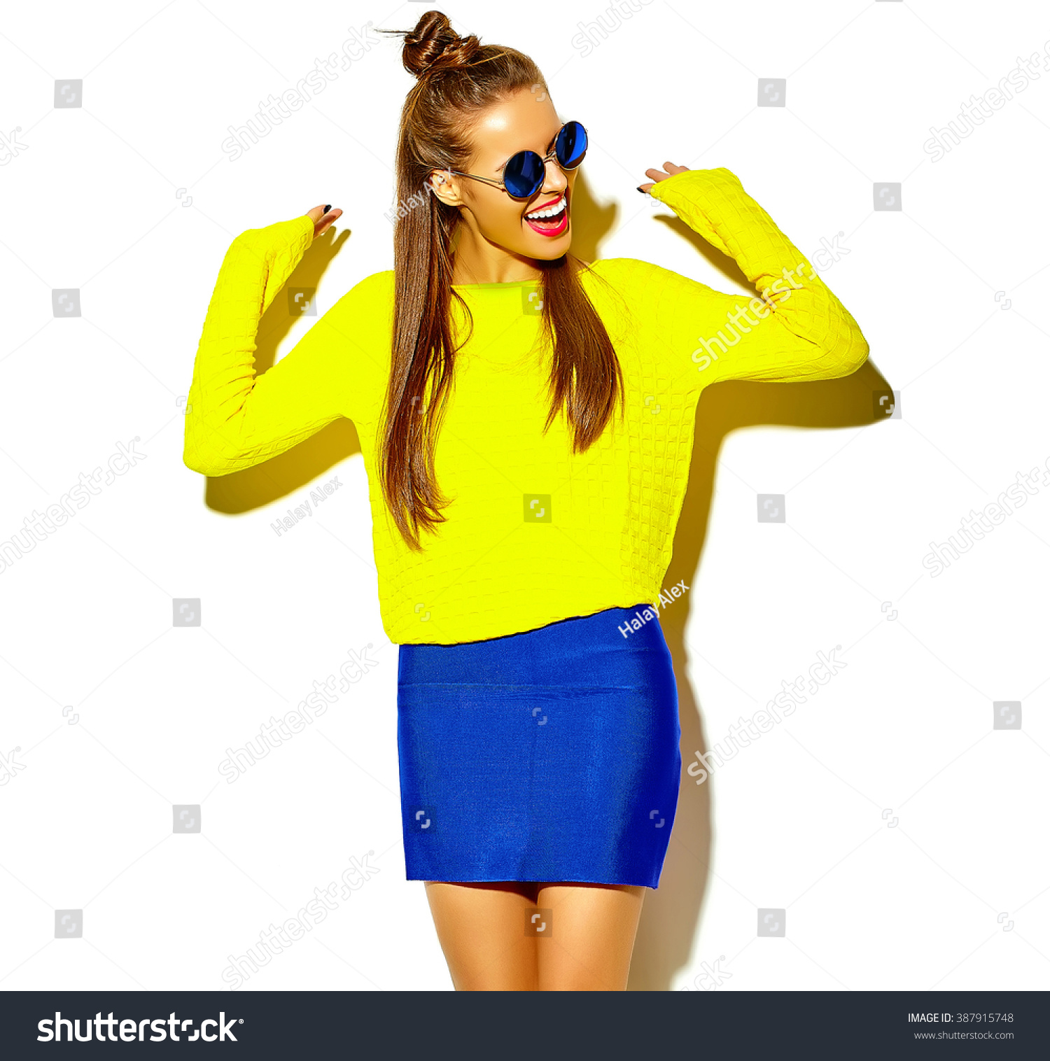 portrait of cheerful fashion hipster girl going crazy  in casual colorful hipster yellow summer clothes with red lips isolated on white #387915748