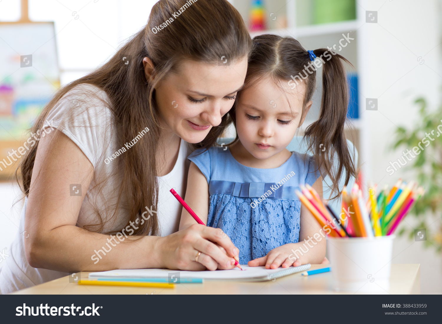 mother and her child pencil together #388433959
