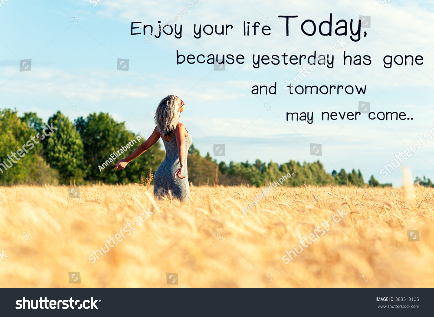 Enjoy your life today because yesterday has gone and tomorrow may never e Inspirational motivating quote with happy woman with opened outstretched arms