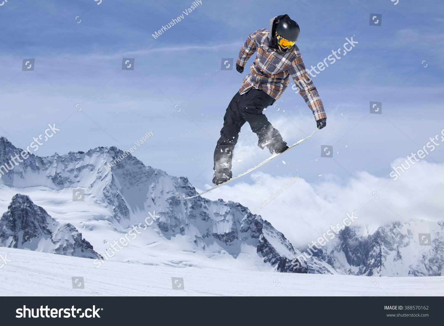 Snowboard jump on mountains. Extreme sport. #388570162