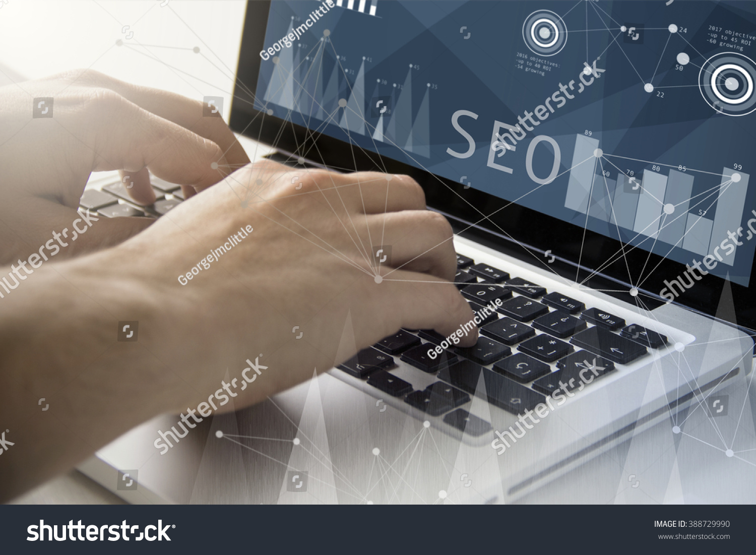 technology and business concept: man using a laptop with seo software on the screen. All screen graphics are made up. #388729990