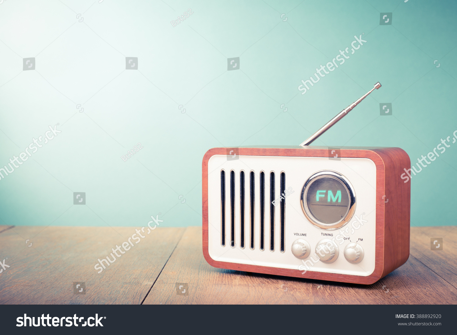 Retro old radio front mint green background. Vintage style filtered photo #388892920