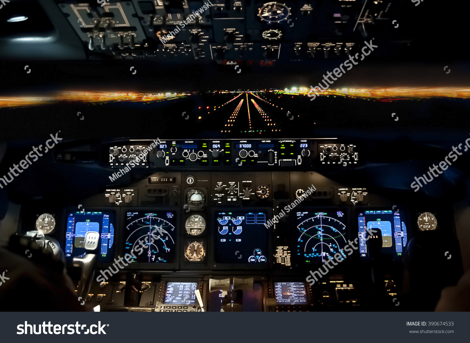 Final approach at night - landing of a jet airliner, view from the cockpit #390674533