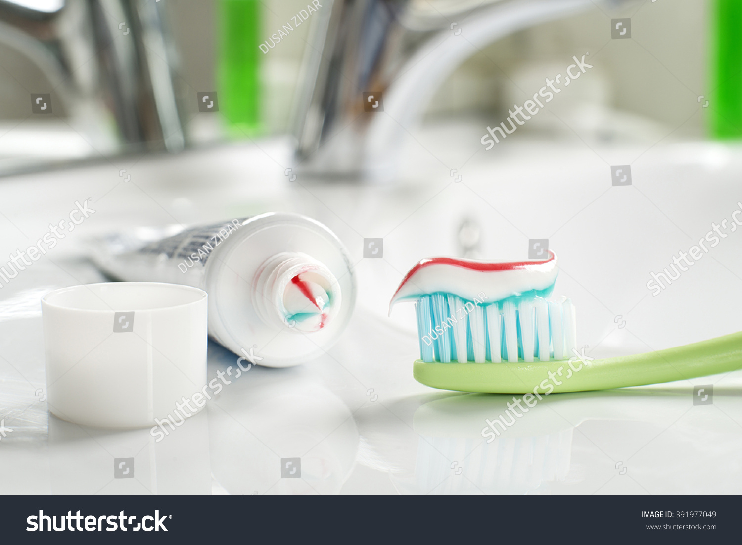 Toothbrushe and toothpaste in the bathroom close up. #391977049