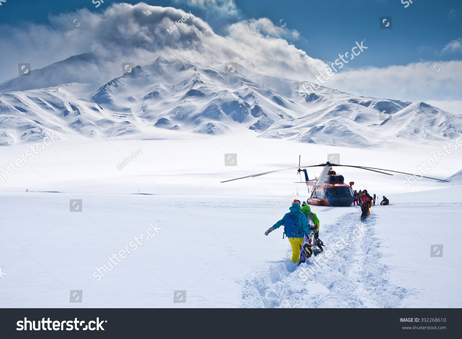 heli-skiing tour around the volcano #392268610