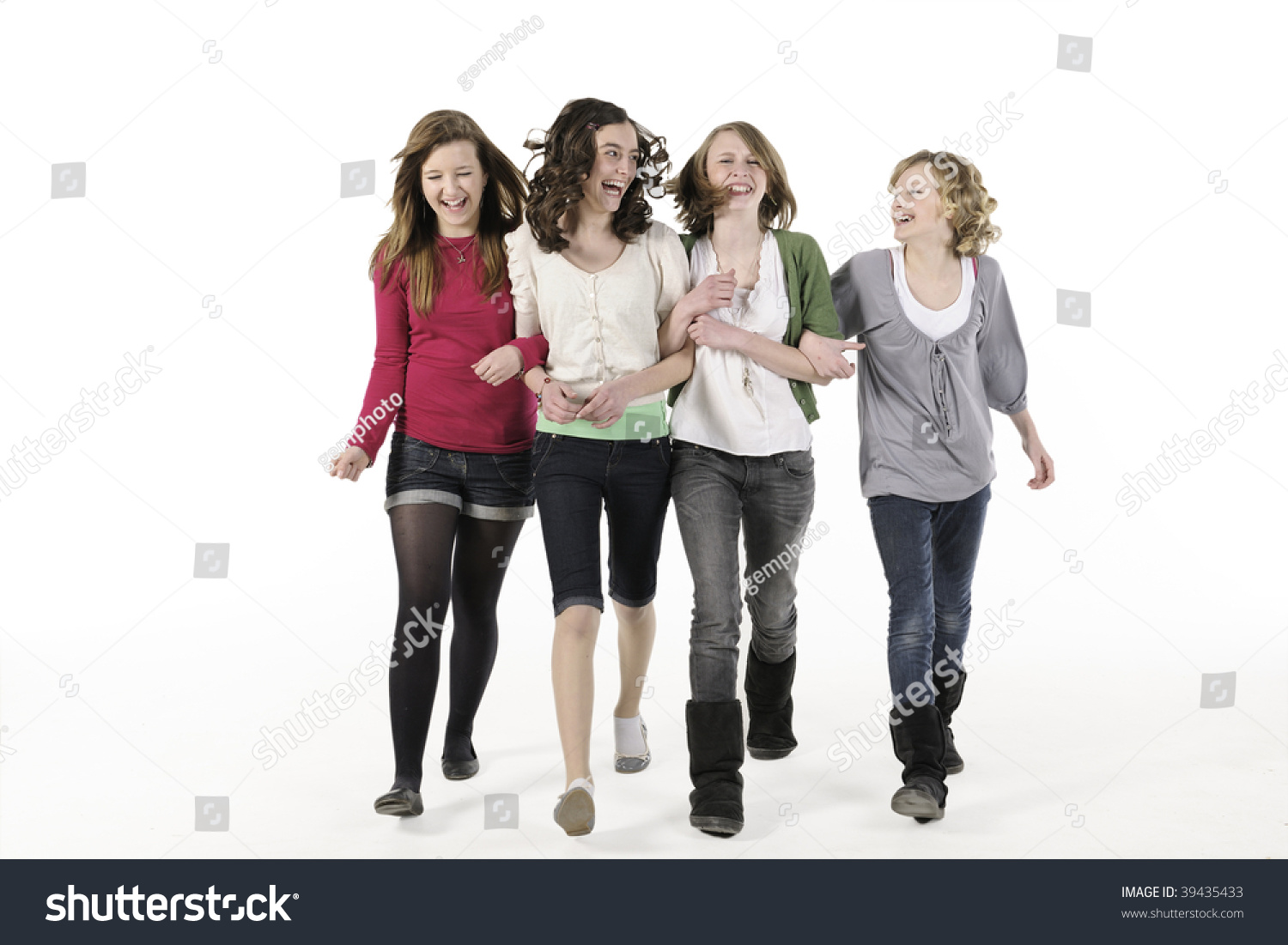 4 Teenage Girls Linking Arms Walking Towards Royalty Free Stock Photo Avopix Com