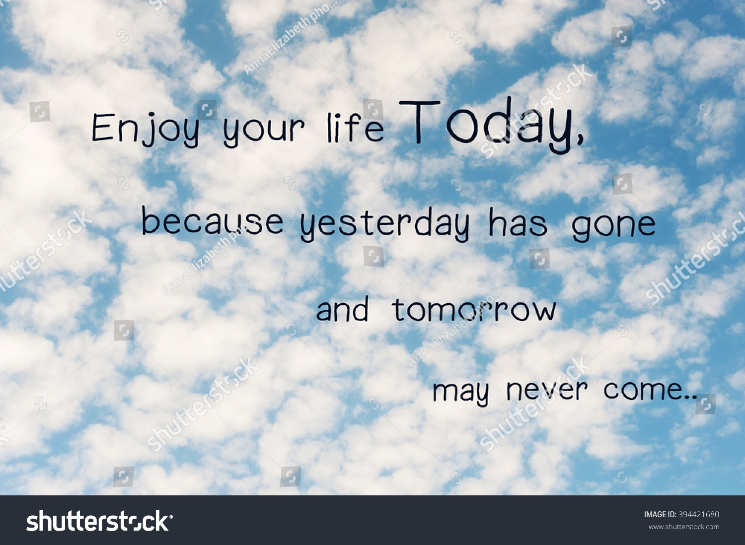 Enjoy your life today because yesterday has gone and tomorrow may never e Inspirational motivating quote on summer cloudy sky background