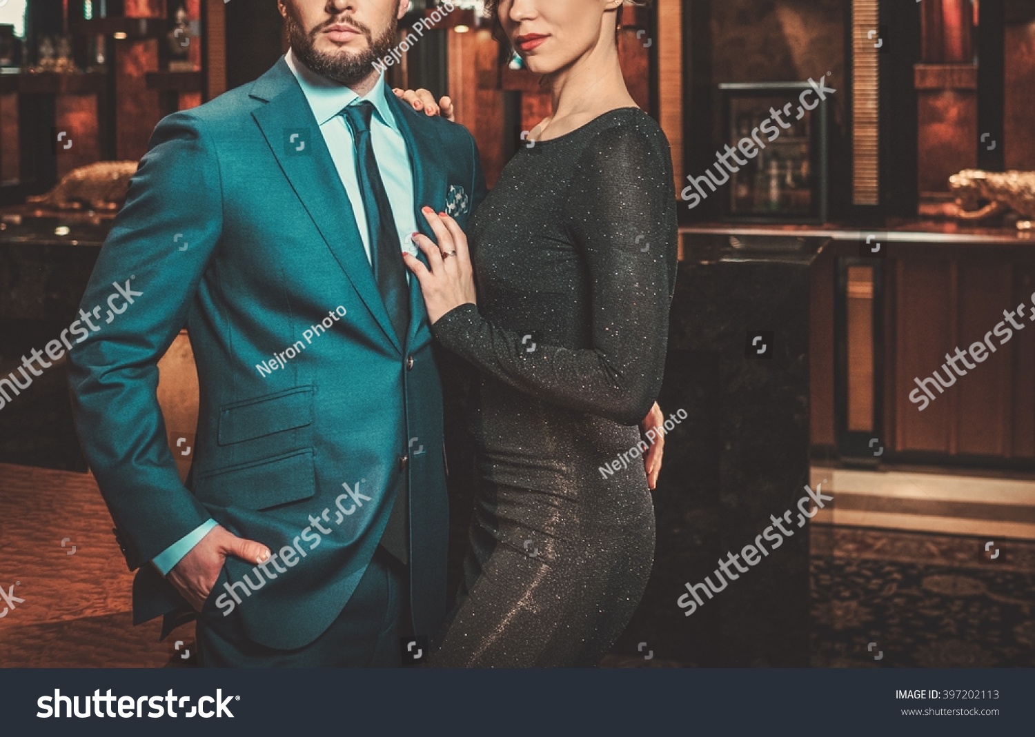 Well-dressed couple in luxury apartment interior. #397202113