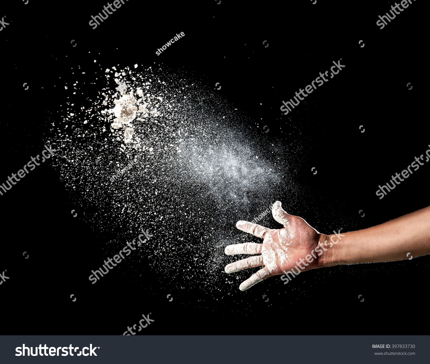 Hand and flour on black background #397833730