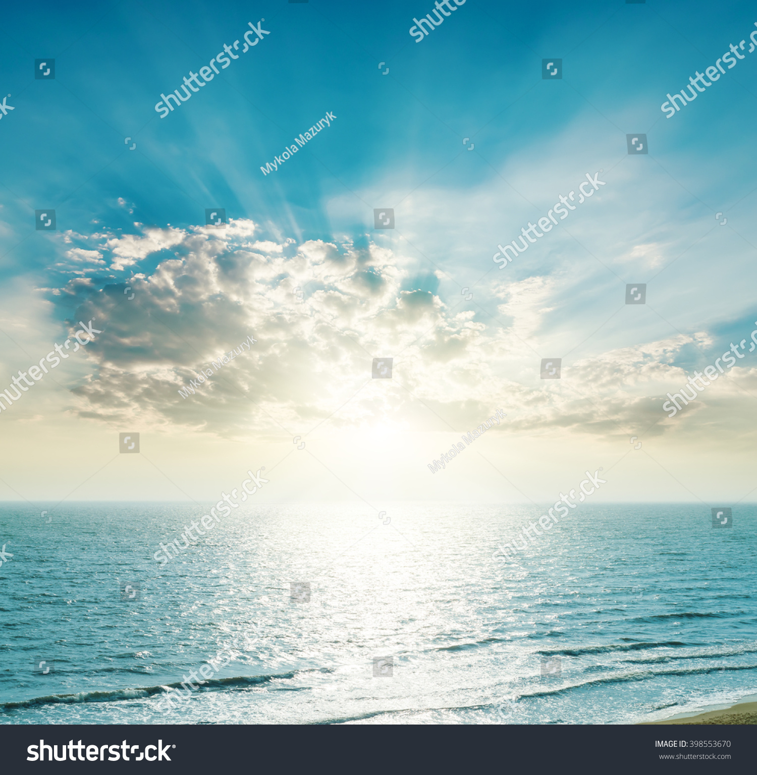 Rising sun on the horizon, blue sea and clouds. Ukrainian Black Sea view. #398553670