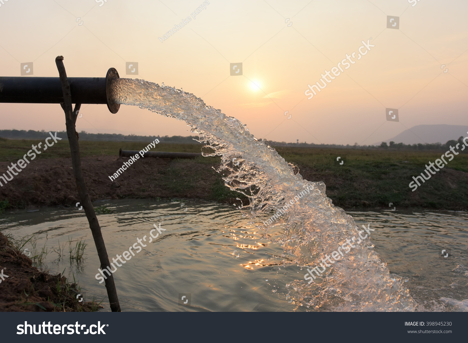 water flow from pipe , sunset  and abstract #398945230