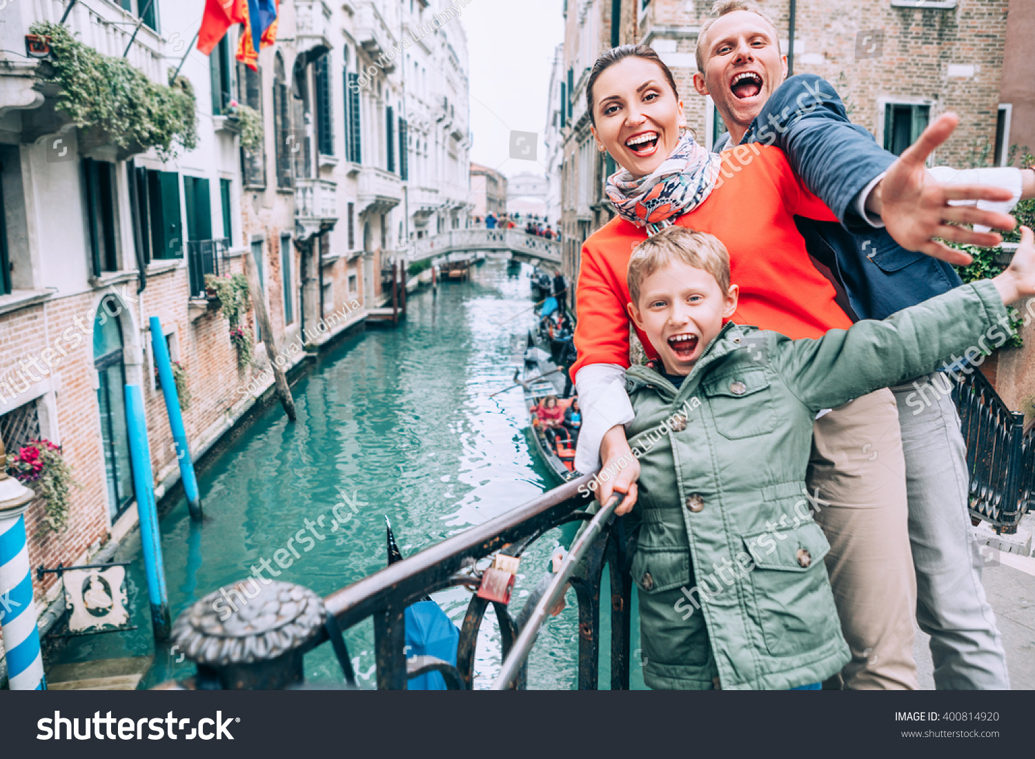 Madly happy family take a selfie photo on the one of bridge in Venice #400814920