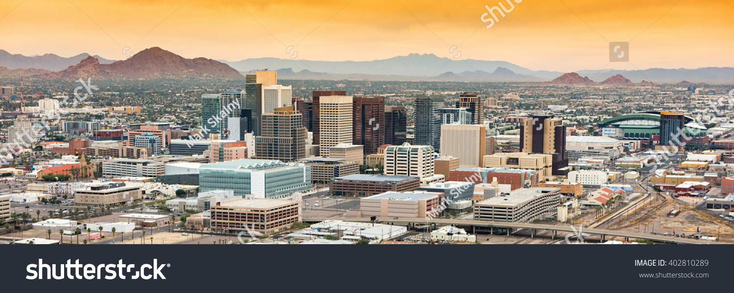 Panoramic aerial view of the Phoenix, Arizona skyline against the day's blue sky. #402810289