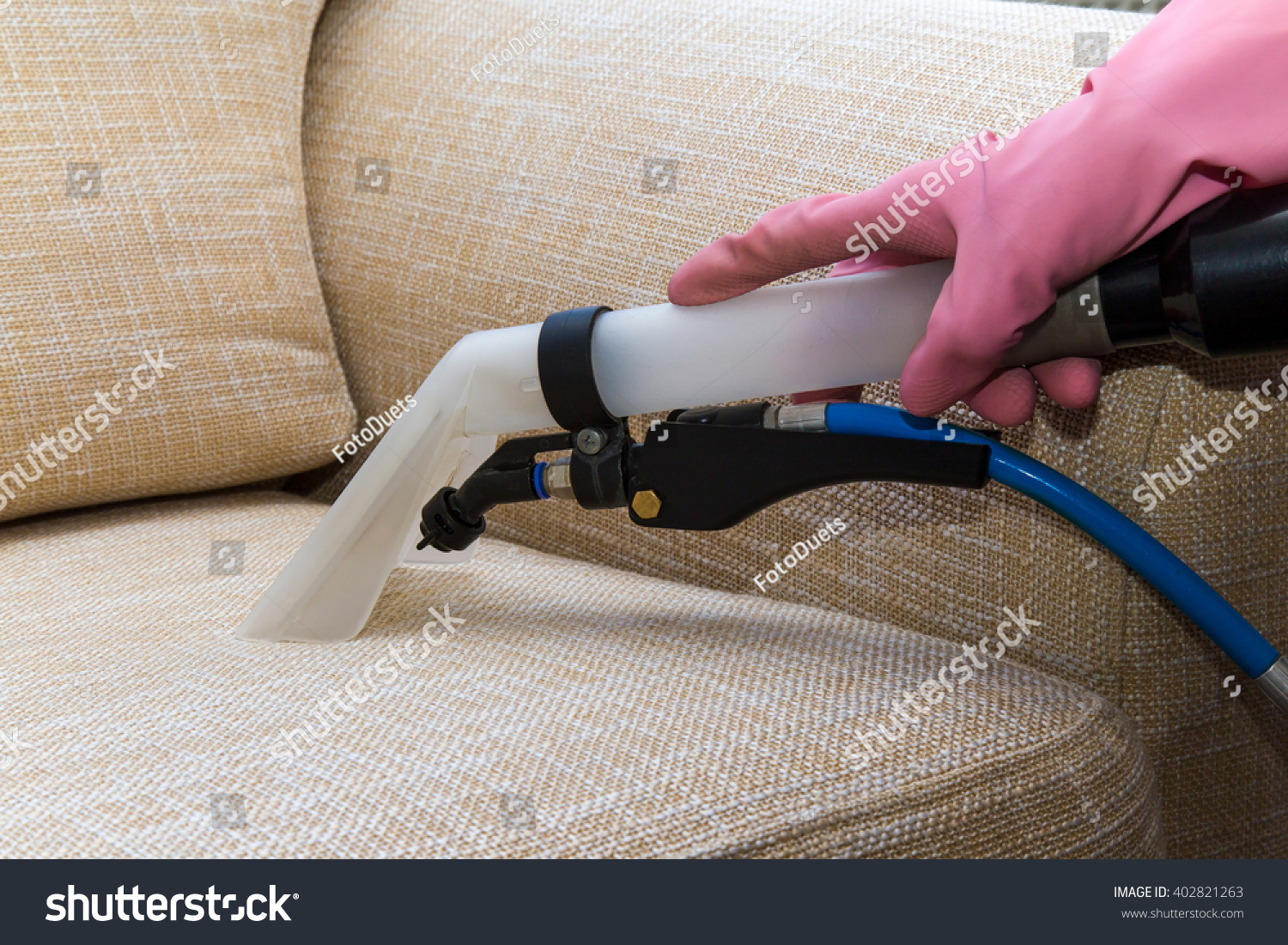 Sofa or armchair chemical cleaning with professionally extraction method. Upholstered furniture. Early spring cleaning or regular clean up.
 #402821263