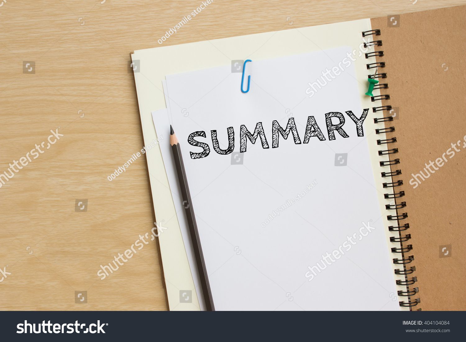 Text Summary on white paper and pencil on the desk / top view / business concept #404104084