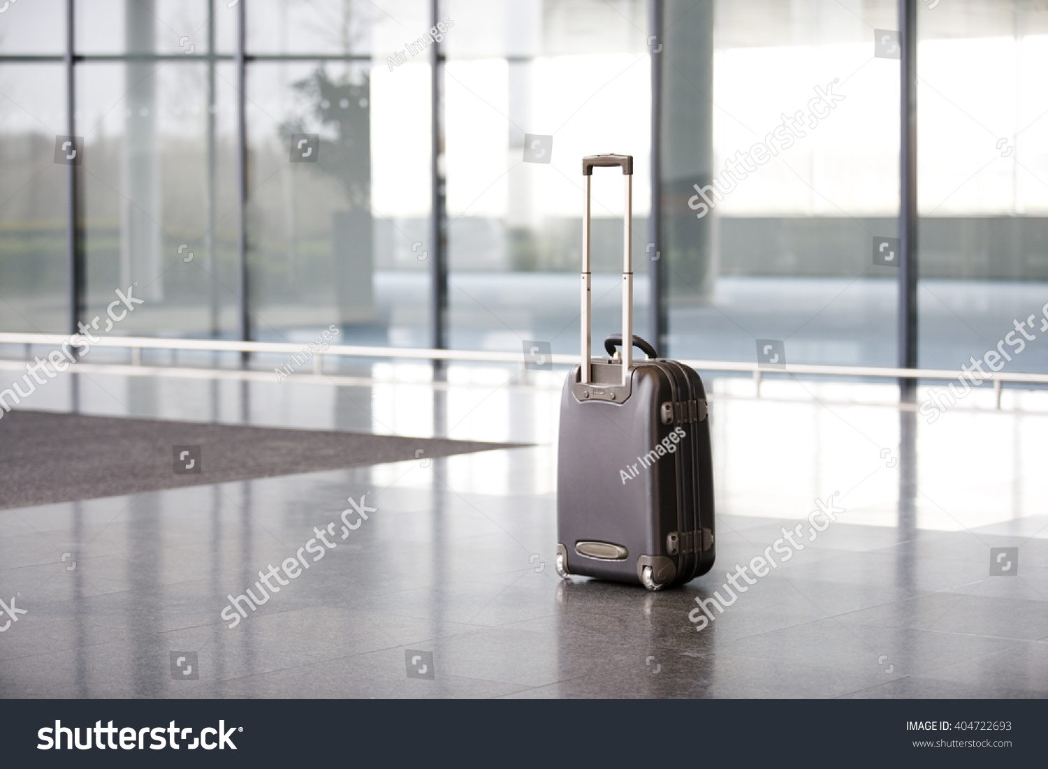 An unattended suitcase in office lobby #404722693