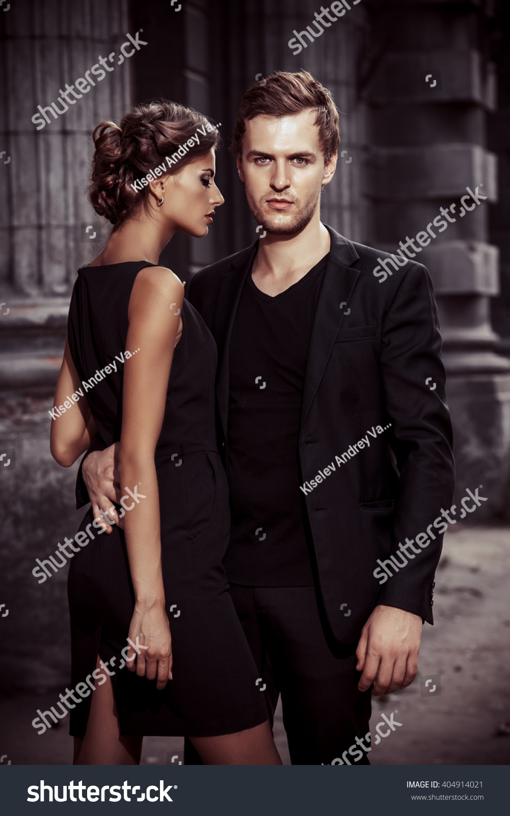 Fashion style photo of a beautiful couple over city background.  #404914021