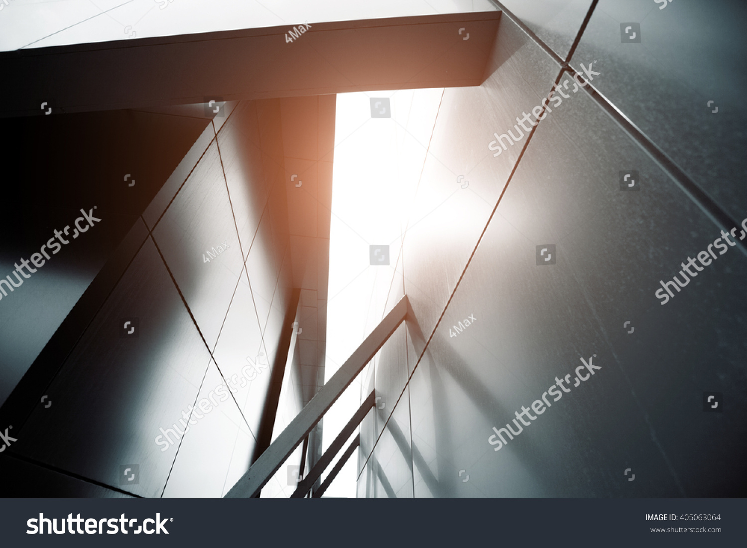 Wide angle abstract background view of steel light blue high rise commercial building skyscraper made of glass exterior. concept of successful industrial architecture and office center building #405063064