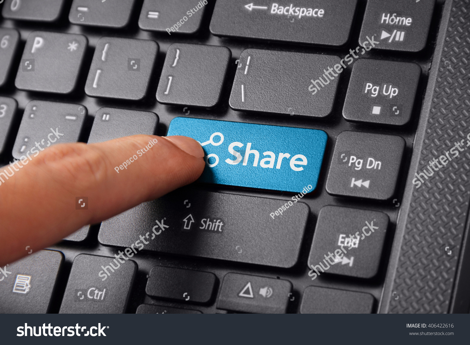 Close up shot of a finger clicking the SHARE button on a laptop keyboard #406422616